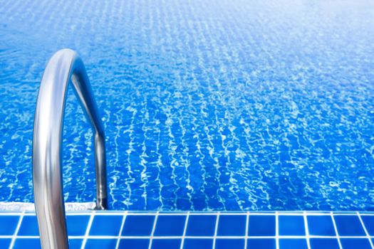 Grab bars stainless in the blue swimming pool