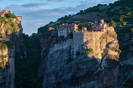 Monastery of Varlaam monastery and Great Meteoron Monastery in famous greek tourist destination Meteora in Greece on sunrise.