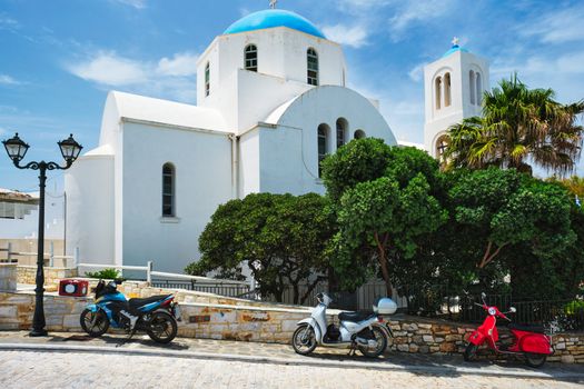 Ttraditional whitewashed orthodox christian church in of Naousa town in famous tourist attraction Paros island, Greece