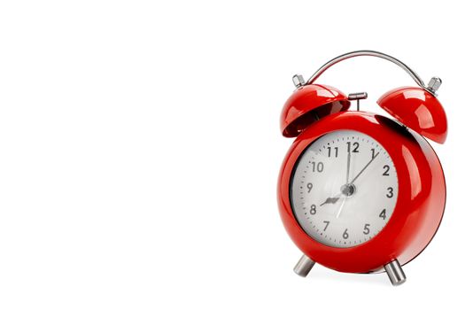 Red alarm clock on white background
