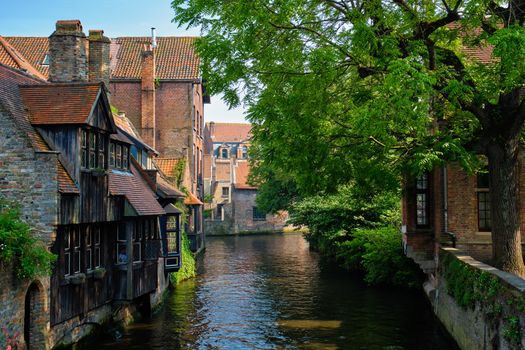 Canal between old houses of famous Flemish medieval city Brugge. Bruges, Belgium