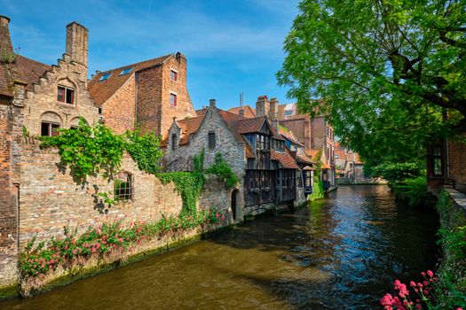 Canal between old houses of famous Flemish medieval city Brugge. Bruges, Belgium