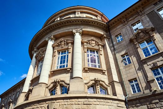 Facade of a historic  Neo-Baroque building with columns  in Poznan