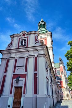 the Baroque building and Catholic Church with belfry in Poznan