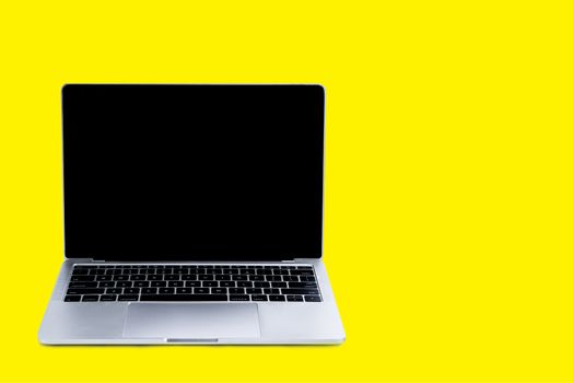 Laptop and mock up screen on yellow background