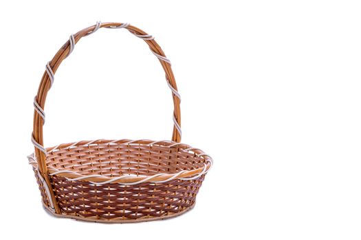 Empty wicker basket with copy space isolated on white background