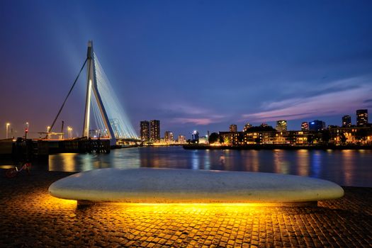 Erasmus Bridge (Erasmusbrug) and Rotterdam skyline illuminated at night. Rotterdam, Netherlands