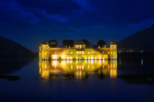 Rajasthan famous tourist landmark - Jal Mahal Water Palace on Man Sagar Lake in the evening in twilight. Jaipur, Rajasthan, India