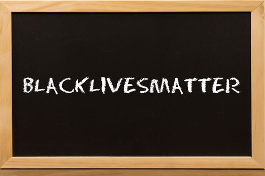 Blacklivesmatter text with copy space on blackboard.