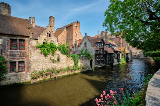 Canal between old houses of famous Flemish medieval city Brugge. Bruges, Belgium