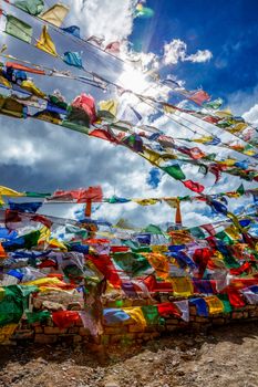 Prayer flags with Buddhist mantra on them at high Kunzum La pass, Himachal Pradesh, India