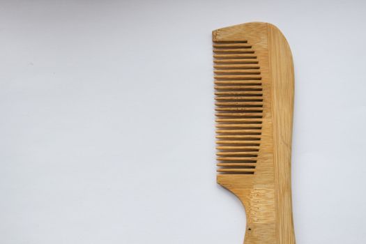 Wooden comb isolated on white background with clipping path