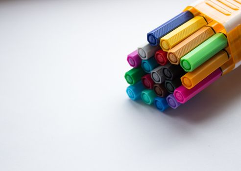 Many different colored pens. Color pencils isolated on a white background.