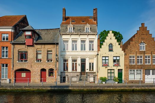 Bruges typical Belgian cityscape Europe tourism concept - canal and old Flemish houses. Brugge, Belgium