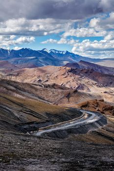Manali-Leh Highway road from Himachal to Ladakh. Beautiful Indian Himalayan landscape is on the way from Kullu valley to Jammu and Kashmir state. Earthroad highway is more than 400 km. North India