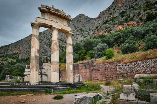 Tholos with Doric columns at the sanctuary of Athena Pronoia temple ruins in ancient Delphi, Greece