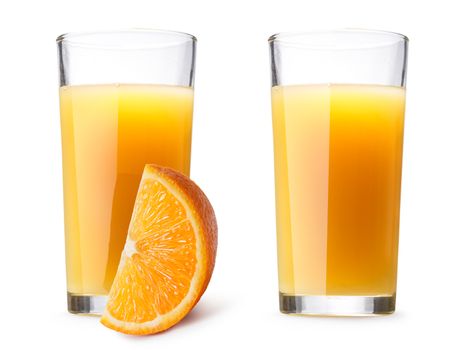 Two glasses (highballs) with orange juice, one glass with orange slice on foreground. Separate clipping paths for each glass  and for shadows. Infinite depth of field