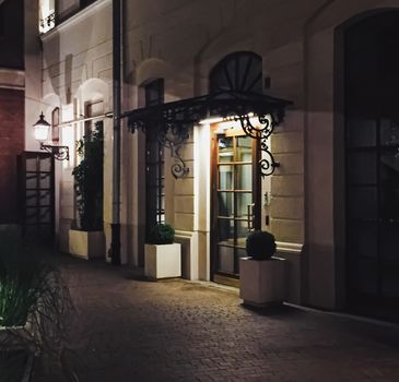 Exterior facade of classic building in the European city at night, architecture and design detail