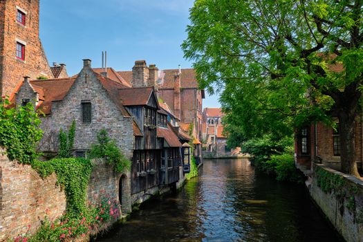 Canal between old houses of famous Flemish medieval city Brugge. Bruges, Belgium