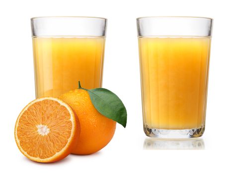 Faceted glasses (highballs) with orange juice, one glass with whole and halved orange on foreground. Separate clipping paths for each glass, for oranges and for shadows. Infinite depth of field