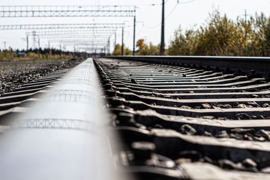 The railroad track closeup. The transport train.