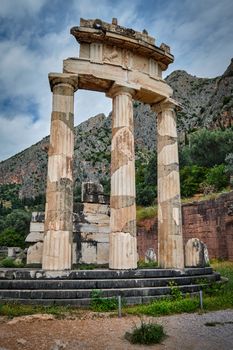 Tholos with Doric columns at the sanctuary of Athena Pronoia temple ruins in ancient Delphi, Greece