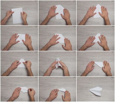 steps of making origami paper airplane on wooden table with arms