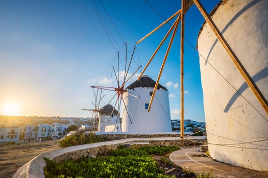 Scenic view of famous Mykonos Chora town windmills. Traditional greek windmills on Mykonos island at sunrise. Cyclades, Greece