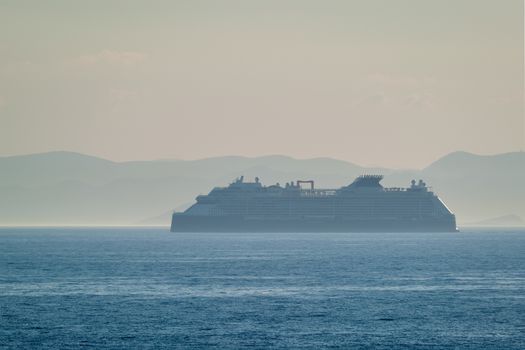 Cruise liner ship silhouette in Mediterranea sea. Aegean sea, Greece