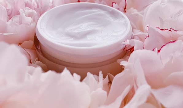 Face cream moisturizer on floral background as luxury skincare cosmetics, healthcare and beauty product concept