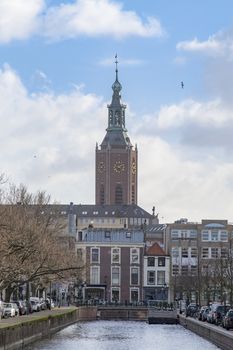 Typical and iconic Dutch canal view on the St Jacob church or Grote Kerk in Dutch in The Hague, Netherlands
