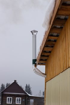 kindling bath in full swing, belching black smoke from the chimney.