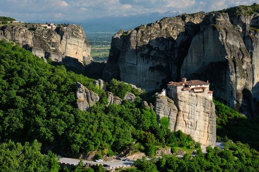 Monastery of Rousanou and Monastery of St. Stephen in famous greek tourist destination Meteora in Greece on sunset with scenic landscape.