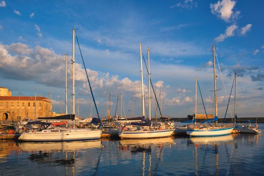 Yachts boats in picturesque old port of Chania is one of landmarks and tourist destinations of Crete island in the morning. Chania, Crete, Greece