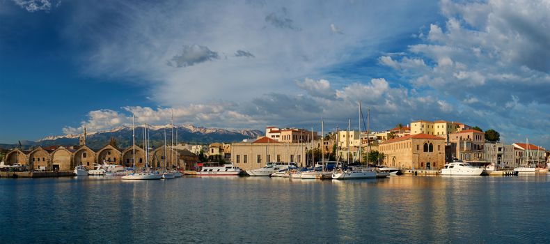 Yachts boats in picturesque old port of Chania is one of landmarks and tourist destinations of Crete island in the morning. Chania, Crete, Greece