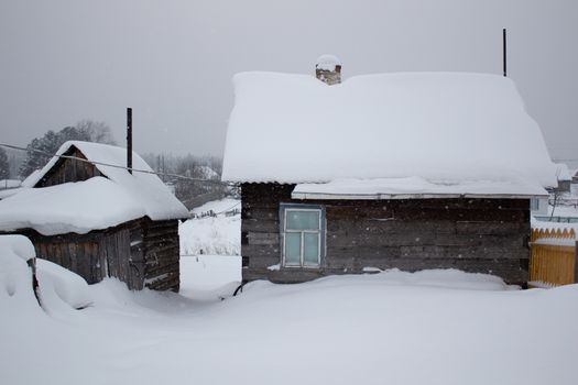 Remote log cabin in untouched snow