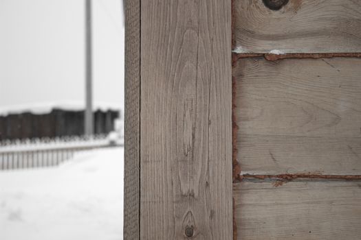 The corner of the wooden house. Close-up. Background. Texture