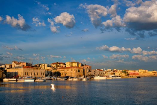 Yachts boats in picturesque old port of Chania is one of landmarks and tourist destinations of Crete island in the morning. Chania, Crete, Greece