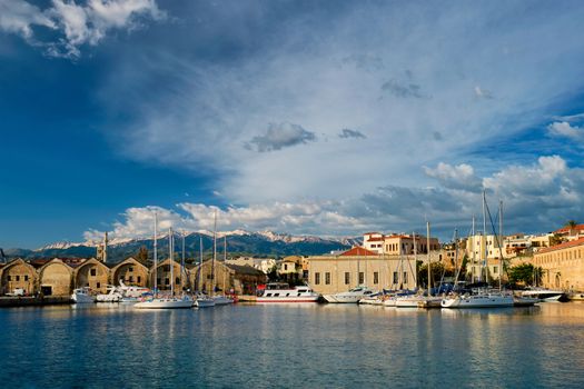 Yachts boats in picturesque old port of Chania is one of landmarks and tourist destinations of Crete island in the morning. Chania, Crete, Greece