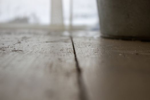 Bucket of water on the table in the cold. Close-up of an ice bucket on the background