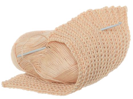 Handmade crochet yarn beige color isolated on a white background.