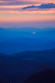Indian sunset in South India Niligiri mountains in Western Ghats. Pothamedu viewpoint, Munnar, Kerala, India