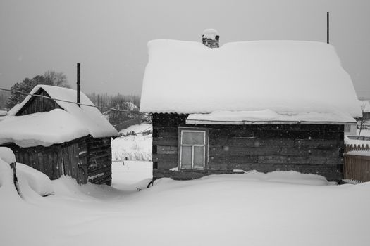 Remote log cabin in untouched snow