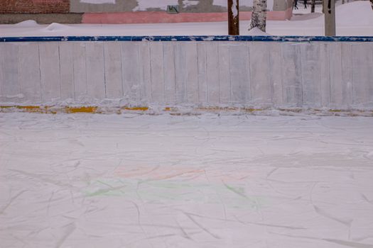 Basketball ring in winter on ice. Ice rink.