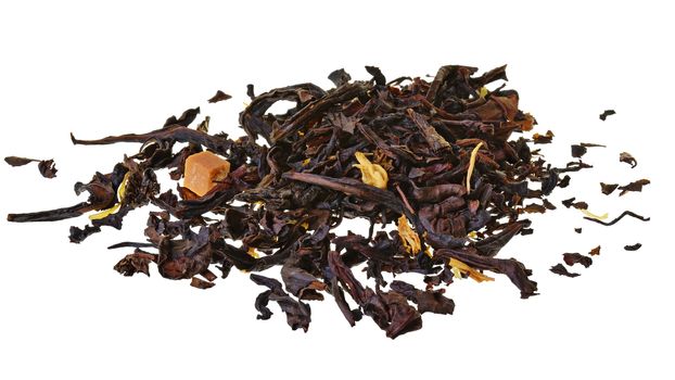 Oolong tea with caramel closeup isolated on a white background.