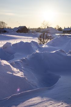 Snow drifts in winter. Winter kind. The snow at sunset. Much snow.