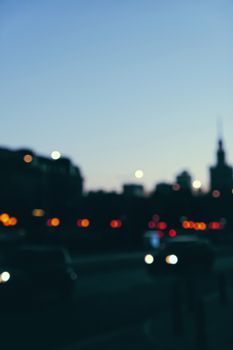 Blurry cityscape silhouette of a European city as background, evening view of Warsaw, Poland