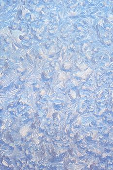 Frosty natural pattern on winter window glass 