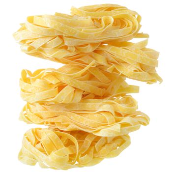 Fettuccine pasta nests close up on a isolated white background.