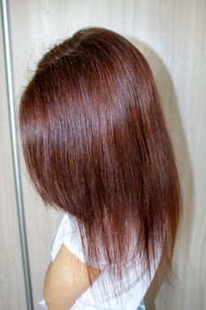 Women's hair is brown. Straight women's hair